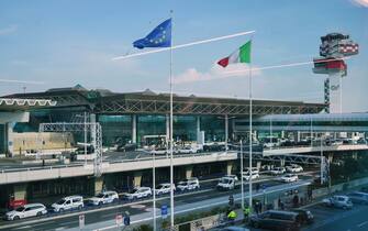 Rome, Italy - Feb 20, 2024:  The exterior and parking at the Fiumicino airport, Leonardo da Vinci–Fiumicino Airport, Aeroporto di Roma, Fiumicino Leonardo da Vinci, and control tower.
