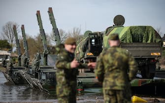 Military vehicles of the Czech Army board a German M3 ferry to cross the Elbe river during the international military exercise "Wettiner Schwert 2024" (Wettin Sword 2024) in Hohengoehren, near Tangermunde, eastern Germany, on March 26, 2024. The NATO exercise "Wettiner Schwert 2024" is part of the "Quadriga 2024" exercise of the German armed forces Bundeswehr. (Photo by Ronny Hartmann / AFP)