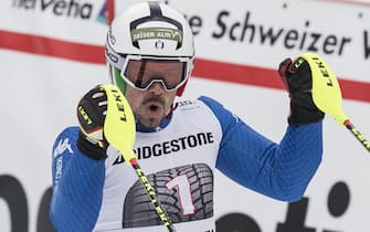 epa06433350 Peter Fill of Italy, third place, celebrates in the finish area after the slalom run of the men's Alpine combined, AC, race at the Alpine Skiing FIS Ski World Cup in Wengen, Switzerland, Friday, January 12, 2018.  EPA/ANTHONY ANEX