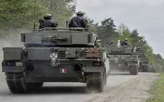 Ariete Italian tanks move to their battle position, during the Strong Europe Tank Challenge (SETC), at the 7th Army Joint Multinational Training Command’s Grafenwoehr Training Area, Grafenwoehr, Germany, May 12, 2016. The SETC is co-hosted by U.S. Army Europe and the German Bundeswehr, May 10-13, 2016. The competition is designed to foster military partnership while promoting NATO interoperability. Seven platoons from six NATO nations are competing in SETC - the first multinational tank challenge at Grafenwoehr in 25 years. For more photos, videos and stories from the Strong Europe Tank Challe