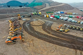 epa10484822 An aerial view of rescue vehicles near the site of a collapsed coal mine in Alxa League, north China's Inner Mongolia Autonomous Region, 23 February 2023. The landslide occurred at the rescue site at around 6 p.m. China Standard Time (CST) on 22 February, according to the rescue headquarters. As of 23 February, more than 900 people had rushed to the site for rescue operations after an open-pit mine collapsed in Alxa Left Banner at around 1 p.m. CST on 22 February, resulting in two deaths, six injuries, and 53 people missing.  EPA/XINHUA/LIAN ZHEN CHINA OUT / MANDATORY CREDIT  EDITORIAL USE ONLY