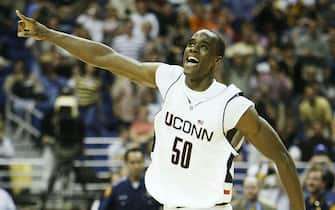 SAN ANTONIO - APRIL 5:  Emeka Okafor #50 of the UConn Huskies celebrates after defeating the Georgia Tech Yellow Jackets 82-73 during the National Championship game of the NCAA Men's Final Four Tournament at the Alamodome on April 5, 2004 in San Antonio, Texas.  (Photo by Stephen Dunn/Getty Images)