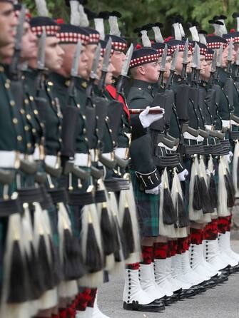 Queen Elizabeth II, with Officer Commanding Major Johnny Thompson, inspects Balaclava Company, 5 Battalion The Royal Regiment of Scotland at the gates at Balmoral, as she takes up summer residence at the castle.