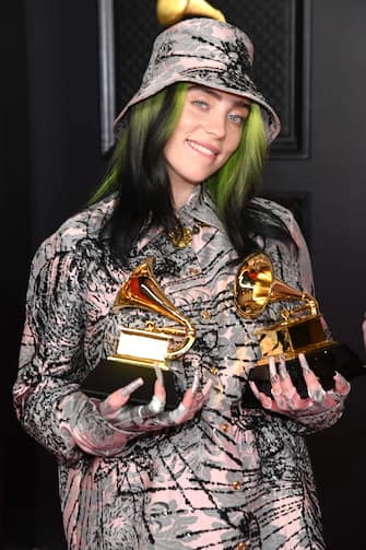 LOS ANGELES, CALIFORNIA - MARCH 14: Billie Eilish, winner of the Record of the Year award for 'Everything I Wanted' and the Best Song Written for Visual Media award for ‚ÄòNo Time to Die,‚Äô poses in the media room during the 63rd Annual GRAMMY Awards at Los Angeles Convention Center on March 14, 2021 in Los Angeles, California.  *** Local Caption *** LOS ANGELES, CALIFORNIA - MARCH 14: Billie Eilish, winner of the Record of the Year award for 'Everything I Wanted' and the Best Song Written for Visual Media award for ‚ÄòNo Time to Die,‚Äô poses in the media room during the 63rd Annual GRAMMY Awards at Los Angeles Convention Center on March 14, 2021 in Los Angeles, California., Credit:ED / CC / Avalon