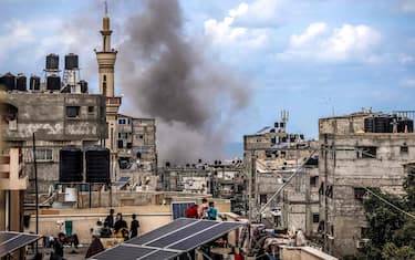 TOPSHOT - A smoke plume erupts during Israeli bombardment on a building in Rafah in the southern Gaza Strip on March 24, 2024 amid the ongoing conflict between Israel and the militant group Hamas. (Photo by AFP)