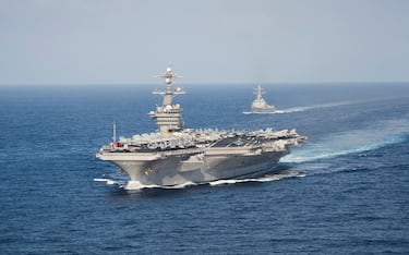 Pacific Ocean, May 23, 2014 - The aircraft carrier USS Carl Vinson (CVN 70) participates in a straits transit exercise with the guided-missile destroyer USS Sterett (DDG 104).