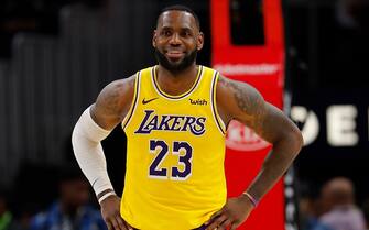 ATLANTA, GEORGIA - DECEMBER 15:  LeBron James #23 of the Los Angeles Lakers enjoys a laugh during the first half against the Atlanta Hawks at State Farm Arena on December 15, 2019 in Atlanta, Georgia.  NOTE TO USER: User expressly acknowledges and agrees that, by downloading and/or using this photograph, user is consenting to the terms and conditions of the Getty Images License Agreement.  (Photo by Kevin C. Cox/Getty Images)