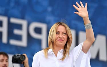 Head of the Brothers of Italy (FdI) party, Giorgia Meloni waves from the stage during a united rally of the League (Lega) party, the Brothers of Italy (FdI) party and the Forza Italia (FI) party for a protest against the government on July 4, 2020 on Piazza del Popolo in Rome, as the country eases its lockdown aimed at curbing the spread of the COVID-19 infection, caused by the novel coronavirus. (Photo by Tiziana FABI / AFP) (Photo by TIZIANA FABI/AFP via Getty Images)