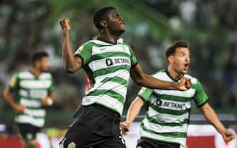 epa10644784 Sporting's Ousmane Diomande (L) celebrates scoring the 2-0 goal during the Portuguese First League soccer match between Sporting CP vs SL Benfica, in Lisbon, Portugal, 21 May 2023.  EPA/JOSE SENA GOULAO