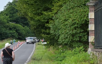 This photograph shows funeral convoy arriving to Delon's property to attend the private funeral service of late French actor Alain Delon La Brulerie in Douchy, central France, on August 24, 2024. French film legend Alain Delon has died at the age of 88, his three children told AFP in a statement on August 18, 2024, following a battle with ill health. (Photo by GUILLAUME SOUVANT / AFP)