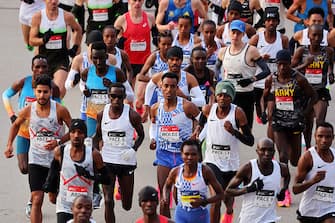 CHICAGO, ILLINOIS - OCTOBER 08: Professional men's and women's runners start the 2023 Chicago Marathon at Grant Park on October 08, 2023 in Chicago, Illinois. (Photo by Michael Reaves/Getty Images)