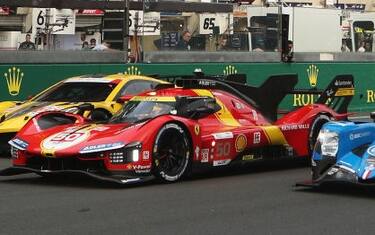 LE MANS, FRANCE - JUNE 08: Hyperclass pole sitting car of  Antonio Fuoco, Miguel Molina and Nicklas Nielsen in the Ferrari AF Corse Ferrari 499P (C), GTE Am pole sitting Corvette Racing Corvette C8.R (L) of Ben Keating, Nicky Catsburg and Nicolas Varrone and LMP2 pole sitting IDEC Sport Oreca 07-Gibson (R) of Paul Lafargue, Paul-Loup Chatin and Laurents Horr on the main straight in the Hyperpole ceremony ahead of the 100th anniversary of the 24 Hours of Le Mans at the Circuit de la Sarthe June 8, 2023 in Le Mans, France. (Photo by Ker Robertson/Getty Images)