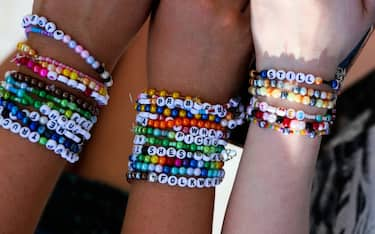 LONDON, ENGLAND - JUNE 21: Taylor Swift fans wearing friendship bracelets, also known as "Swifties", arrive at Wembley Stadium ahead of her opening night performance in the capital on June 21, 2024 in London, England. The Eras Tour, which spans 22 countries over 152 shows, has generated an estimated £1.7 billion (over $2.1 billion USD) in revenue, making it the highest-grossing concert tour of all time, surpassing the lines of Elton John, Coldplay and U2. (Photo by Alishia Abodunde/Getty Images)