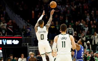 MILWAUKEE, WISCONSIN - JANUARY 14: Damian Lillard #0 of the Milwaukee Bucks hits the winning shot with no time left on clock against the Sacramento Kings at Fiserv Forum on January 14, 2024 in Milwaukee, Wisconsin. NOTE TO USER: User expressly acknowledges and agrees that, by downloading and or using this photograph, User is consenting to the terms and conditions of the Getty Images License Agreement. (Photo by John Fisher/Getty Images)