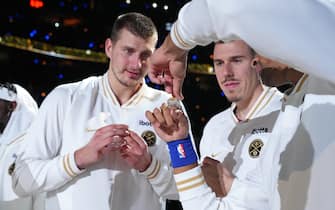 DENVER, CO - OCTOBER 24: Nikola Jokic #15 of the Denver Nuggets looks at his championship ring before the game against the Los Angeles Lakers on October 24, 2023 at the Ball Arena in Denver, Colorado. NOTE TO USER: User expressly acknowledges and agrees that, by downloading and/or using this Photograph, user is consenting to the terms and conditions of the Getty Images License Agreement. Mandatory Copyright Notice: Copyright 2023 NBAE (Photo by Garrett Ellwood/NBAE via Getty Images)