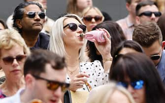 epa11475708 Spectators wait for the Women's Singles final match at the Wimbledon Championships in London, Britain, 13 July 2024.  EPA/TOLGA AKMEN  EDITORIAL USE ONLY