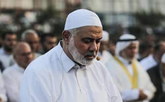 epa06962124 Hamas top leader Shiekh Ismail Haniyeh leads prayer on the first day of Eid al Adha in Gaza City, 21 August 2018. Eid al-Adha is the holiest of the two Muslims holidays celebrated each year, it marks the yearly Muslim pilgrimage (Hajj) to visit Mecca, the holiest place in Islam. Muslims slaughter a sacrificial animal and split the meat into three parts, one for the family, one for friends and relatives, and one for the poor and needy.  EPA/HAITHAM IMAD