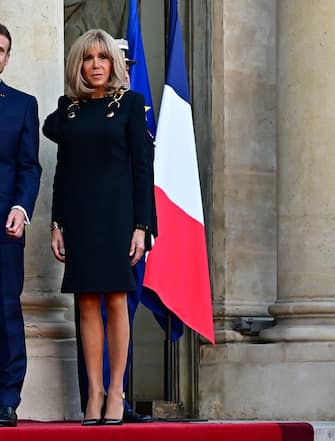PARIS, FRANCE - SEPTEMBER 21: (L-R) Queen Camilla, King Charles III, President Emmanuel Macron, and Brigitte Macron are seen at the Élysée Palace on September 21, 2023 in Paris, France. The King and The Queen's first state visit to France will take place in Paris, Versailles and Bordeaux from Wednesday 20th to Friday 23rd 2023. The visit had been initially scheduled for March 26th - 29th but had to be postponed due to mass strikes and protests. (Photo by Christian Liewig - Corbis/Corbis via Getty Images)