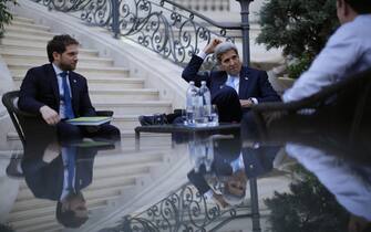 US Secretary of State John Kerry (C) and State Department Chief of Staff Jon Finer (L) meet with members of the US delegation at the garden of the Palais Coburg hotel where the Iran nuclear talks meetings are being held in Vienna, Austria July 10, 2015. Iran accused major powers on Friday of backtracking on previous pledges and throwing up new "red lines" at nuclear talks, after the deadline to reach an agreement in time to receive expedited scrutiny from the US Congress expired with no deal. AFP PHOTO / POOL / CARLOS BARRIA        (Photo credit should read CARLOS BARRIA, CARLOS BARRIA/AFP via Getty Images)