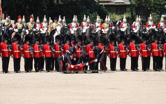 LONDON, ENGLAND - JUNE 10: A Welsh Guardsman is stretchered away while Prince William, Prince of Wales Carries Out The Colonel's Review at Horse Guards Parade on June 10, 2023 in London, England. The Prince of Wales carried out the review of the Welsh Guards for the first time as Colonel of the Regiment. It is the final evaluation of the King's Birthday parade ahead of the event on June 17.  (Photo by Tristan Fewings/Getty Images)