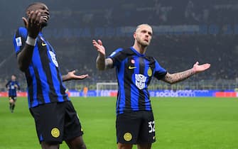 MILAN, ITALY - DECEMBER 09:  Federico Dimarco of FC Internazionale celebrates with Marcus Thuram after scoring the goal during the Serie A TIM match between FC Internazionale and Udinese Calcio at Stadio Giuseppe Meazza on December 09, 2023 in Milan, Italy. (Photo by Mattia Pistoia - Inter/Inter via Getty Images)