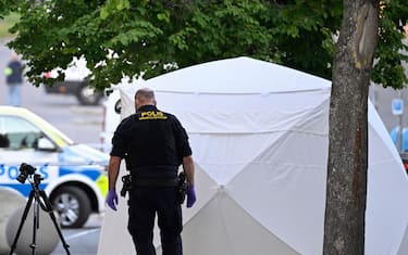 Police forensic officers work at the scene of a shooting incident at Farsta shopping center in the south of Stockholm on June 10, 2023. (Photo by Anders WIKLUND / various sources / AFP) / Sweden OUT (Photo by ANDERS WIKLUND/TT NEWS AGENCY/AFP via Getty Images)