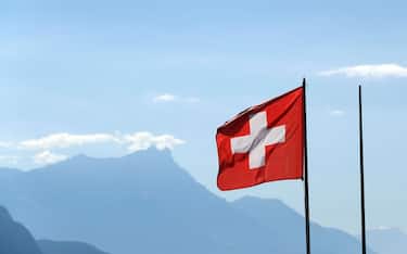 Swiss flag.  Vevey. Switzerland. (Photo by: Godong/Universal Images Group via Getty Images)
