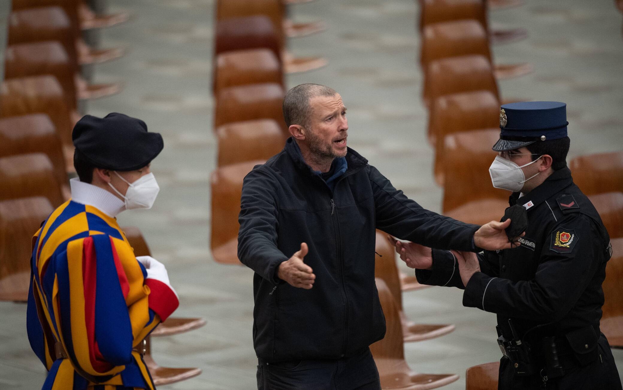 A man is escorted by the Vatican gendarmes, after shouted  during Pope FrancisÕ weekly general audience in Paolo VI Hall at the Vatican, Vatican City, 2 February 2022.  ANSA/ MAURIZIO BRAMBATTI