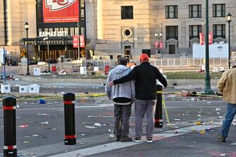 epa11153739 People look at the scene around Union Station after a shooting following the NFL Super Bowl LVIII Victory Parade for the Kansas City Chiefs in downtown Kansas City, Missouri, USA, 14 February 2024. According to the Kansas City Missouri police department (KCPD) and KCPD Chief Stacey Graves, shots were fired west of Union Station at the conclusion of the Chiefs rally. Two suspects were detained. Multiple people were shot, with one of them confirmed as deceased.  EPA/DAVE KAUP