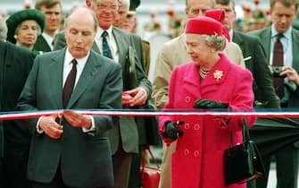 French President Francois Mitterand and the Queen prepare to cut the ribbon at the new terminal for the Channel Tunnel at Coquelles, France.   (Photo by Tim Ockenden - PA Images/PA Images via Getty Images)