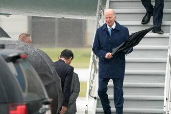 IWAKUNI, JAPAN - MAY 18: U.S. President Joe Biden (R) arrives at Marine Corps Air Station Iwakuni on May 18, 2023 in Iwakuni, Japan. Biden arrived in Japan to attend the G7 summit, which will take place in Hiroshima. (Photo by Tomohiro Ohsumi/Getty Images)
