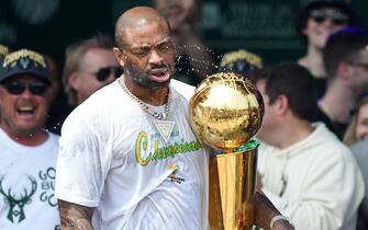 MILWAUKEE, WISCONSIN - JULY 22: P.J. Tucker celebrates with the Larry O'Brien trophy during the Milwaukee Bucks 2021 NBA Championship Victory Parade and Rally in the Deer District of Fiserv Forum on July 22, 2021 in Milwaukee, Wisconsin. (Photo by Patrick McDermott/Getty Images)