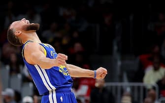 ATLANTA, GEORGIA - FEBRUARY 03:  Stephen Curry #30 of the Golden State Warriors reacts after a dunk by Trayce Jackson-Davis #32 against the Atlanta Hawks during the fourth quarter at State Farm Arena on February 03, 2024 in Atlanta, Georgia.  NOTE TO USER: User expressly acknowledges and agrees that, by downloading and/or using this photograph, user is consenting to the terms and conditions of the Getty Images License Agreement.  (Photo by Kevin C. Cox/Getty Images)