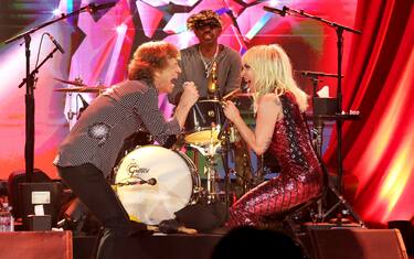 NEW YORK, NEW YORK - OCTOBER 19:  (Exclusive Coverage) Mick Jagger and Lady Gaga perform during The Rolling Stones surprise set in celebration of their new album â  Hackney Diamondsâ   at Racket NYC on October 19, 2023 in New York City. (Photo by Kevin Mazur/Getty Images for RS)