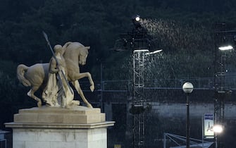 epa11497778 Rain falls at the Trocadero during the Opening Ceremony of the Paris 2024 Olympic Games, in Paris, France, 26 July 2024.  EPA/CHRISTOPHE PETIT TESSON / POOL