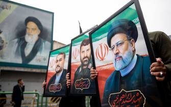Mandatory Credit: Photo by Sobhan Farajvan/Pacific Press/Shutterstock (14496235j)
Iranian people hold portraits of President Ebrahim Raisi(c) and his two aides during a mourners rally for President Ebrahim Raisi in downtown Tehran, Iran, on Tuesday, May 21, 2024. President Raisi and the country's foreign minister, Hossein Amirabdollahian, were found dead Monday hours after their helicopter crashed in fog.
Mourners rally for the President Ebrahim Raisi, Tehran, Iran - 21 May 2024