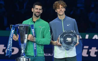 Novak Djokovic (L) of Serbia celebrates with the trophy after winning the final against Jannik Sinner (R) of Italy at the Nitto ATP Finals tennis tournament in Turin, Italy, 19 November 2023. 
ANSA/ALESSANDRO DI MARCO