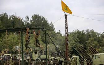 21 May 2023, Lebanon, Aramta: Pro-Iranian Hezbollah fighters display a US made anti-tank TOW missile during a staged military exercise in a camp in the Lebanese southern village of Aramta. The show came ahead of the 23rd "Liberation Day", the annual celebration of the withdrawal of Israeli forces from south Lebanon on May 25, 2000. Photo: Marwan Naamani/dpa (Photo by Marwan Naamani/picture alliance via Getty Images)