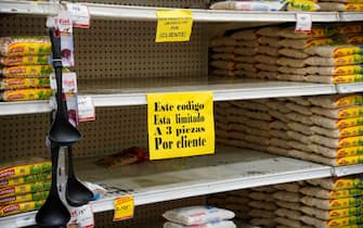 A partially empty shelf is pictured with a sign that reads in Spanish, "This code is limited to 3 pieces for client" at a supermarket before the arrival of Hurricane Beryl in the tourist city of Cancun, Quintana Roo State, Mexico on July 2, 2024. Hurricane Beryl was hurtling towards Jamaica on July 2, as a monster Category 5 storm, after killing at least five people and causing widespread destruction in a deadly sweep across the southeastern Caribbean. (Photo by Elizabeth RUIZ / AFP) (Photo by ELIZABETH RUIZ/AFP via Getty Images)