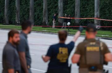 WEST PALM BEACH, FLORIDA - SEPTEMBER 15: Law enforcement personnel investigate the area around Trump International Golf Club after an apparent assassination attempt of former President Donald Trump on September 15, 2024 in West Palm Beach, Florida. The FBI and U.S. Secret Service, along with the Palm Beach County Sheriff's office, are investigating the incident, which the FBI said "appears to be an attempted assassination of former President Trump" while he was golfing at the course. (Photo by Joe Raedle/Getty Images)