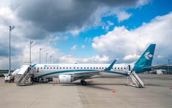 MUNICH, GERMANY, 11JUL2018.  An Air Dolomiti plane at Munich airport.  Photo by Enrique Shore