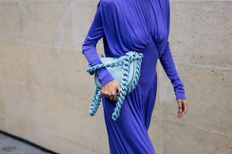PARIS, FRANCE - OCTOBER 03: Leonie Hanne wears blue dress, turquoise bag, heels outside Stella McCartney during Paris Fashion Week - Womenswear Spring/Summer 2023 : Day Eight on October 03, 2022 in Paris, France. (Photo by Christian Vierig/Getty Images)