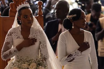 The Inhebantu (Queen) Jovia Mutesi (L) gestures during her royal wedding with the Kyabazinga (King) of the Busoga Kingdom William Gabula Nadiope IV at the Christ's Cathedral Bugembe in Jinja on November 18, 2023. (Photo by BADRU KATUMBA / AFP) (Photo by BADRU KATUMBA/AFP via Getty Images)