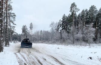 15 December 2023, Lithuania, Rukla: A Leopard 2 A6 tank drives at the Lithuanian Gaiziunai military training area, around 90 kilometers northwest of the capital Vilnius. The first Leopard 2 tanks delivered to Ukraine and damaged in the battle against Russia have been repaired in Lithuania. The repaired battle tanks will soon return to the battlefield in the Baltic EU and NATO country. Photo: Alexander Welscher/dpa (Photo by Alexander Welscher/picture alliance via Getty Images)