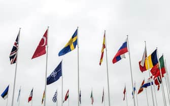 BRUSSELS, BELGIUM - MARCH 11: The flag of Sweden is seen flying next to the NATO flag and the flags of some of the member countries during a ceremony marking Sweden's accession to NATO outside NATO headquarters on March 11, 2024 in Brussels, Belgium. The ceremony was held to mark Sweden's accession to the military alliance, which was made official last week after the country shed its previously neutral stance. Sweden, like Finland, were spurred to join the alliance after Russia's invasion of Ukraine. (Photo by Omar Havana/Getty Images)