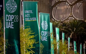 epa11011484 Banners with the COP28 logo stand at Expo City Dubai, the venue of the 2023 United Nations Climate Change Conference (COP28), in Dubai, United Arab Emirates, 05 December 2023. The 2023 United Nations Climate Change Conference (COP28), runs from 30 November to 12 December, and is expected to host one of the largest number of participants in the annual global climate conference as over 70,000 estimated attendees, including the member states of the UN Framework Convention on Climate Change (UNFCCC), business leaders, young people, climate scientists, Indigenous Peoples and other relevant stakeholders will attend.  EPA/MARTIN DIVISEK