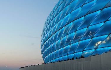 MUNICH, GERMANY - MAY 19: The new Allianz Arena football stadium is lit up during an exhibition match between traditional teams 1860 Munich and Bayern Munich on May 19, 2005 in Munich, Germany.  Former players from both clubs gathered for the first match to be held in the stadium that will be the new home of both clubs and one of the host stadiums for the 2006 FIFA World Cup Germany.  (Photo by Sandra Behney/Bongarts/Getty Images)