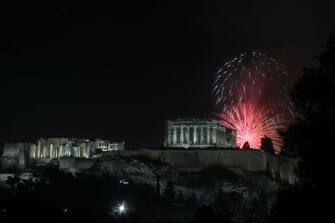 Fireworks explode over the temple of Parthenon at the top of Acropolis hill during the New Year celebrations in Athens, Greece on January 1, 2023. Dimitris Kapantais / SOOC (Photo by Dimitris Kapantais / SOOC / SOOC via AFP) (Photo by DIMITRIS KAPANTAIS/SOOC/AFP via Getty Images)