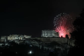 Fireworks explode over the temple of Parthenon at the top of Acropolis hill during the New Year celebrations in Athens, Greece on January 1, 2023. Dimitris Kapantais / SOOC (Photo by Dimitris Kapantais / SOOC / SOOC via AFP) (Photo by DIMITRIS KAPANTAIS/SOOC/AFP via Getty Images)