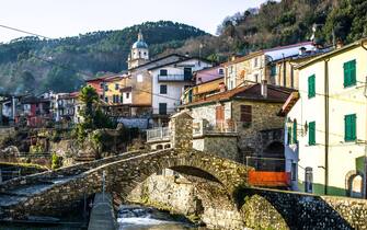 Scenic view of italian village with iconic roman bridge during winter, Pignone, La spezia, Liguria, Italy